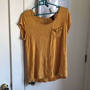 yellow tee with lace detailing and pocket